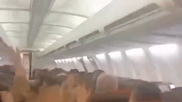 plane-passengers-scream-in-harrowing-mid-flight-video-as-violent-shaking-sends-cabin-ceiling-panels-flying